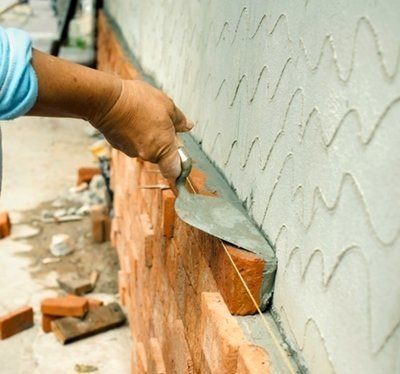 Acryl-A-Seal seals masonry with a semi-glossy finish Mason Laying Brick